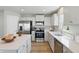 Modern kitchen showcases stainless steel appliances, quartz countertops, and ample storage space at 4182 Hume Ave, Plainfield, IN 46168