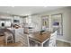 Open-concept kitchen and dining area with a large island and stainless steel appliances at 4182 Hume Ave, Plainfield, IN 46168
