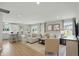 Open-concept living room featuring neutral decor, hardwood floors, and ample natural light at 4182 Hume Ave, Plainfield, IN 46168