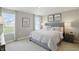 Serene main bedroom with large windows, plush carpeting, and a comfortable, upholstered bed frame at 4182 Hume Ave, Plainfield, IN 46168
