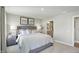 Comfortable main bedroom featuring neutral tones, soft carpet, and ensuite bathroom access at 4182 Hume Ave, Plainfield, IN 46168