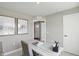 Bright home office showcasing modern desk, chair, and neighborhood views at 4182 Hume Ave, Plainfield, IN 46168