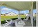 Covered patio with outdoor seating at 4182 Hume Ave, Plainfield, IN 46168