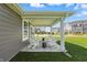 Covered patio with chairs and tables at 4182 Hume Ave, Plainfield, IN 46168