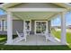 Covered patio with chairs and a view of the backyard at 4182 Hume Ave, Plainfield, IN 46168