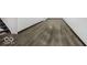 Spacious basement with new wood flooring and freshly painted white walls at 4337 N Audubon Rd, Indianapolis, IN 46226