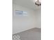 This bedroom includes carpeted floors and natural light from one window at 4337 N Audubon Rd, Indianapolis, IN 46226