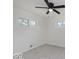 This bedroom includes carpeted floors, a ceiling fan, and natural light from two windows at 4337 N Audubon Rd, Indianapolis, IN 46226