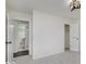 This bedroom includes carpeted floors, a closet, and a doorway to an adjoining bathroom at 4337 N Audubon Rd, Indianapolis, IN 46226