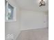 This bedroom includes carpeted floors and natural light from one window at 4337 N Audubon Rd, Indianapolis, IN 46226