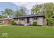 Lovely home with a green lawn and tidy landscaping at 4337 N Audubon Rd, Indianapolis, IN 46226