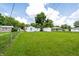 Picture showing the rear view of the house, detached garage, and fenced yard at 4639 Terrace Ave, Indianapolis, IN 46203