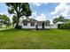 Charming home featuring a well-manicured lawn and beautiful, mature tree offering shade at 4639 Terrace Ave, Indianapolis, IN 46203