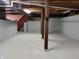 Spacious unfinished basement with concrete floors and support pillars is ready for customization and storage at 5052 Helmsburg School Rd, Morgantown, IN 46160
