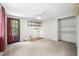 Bedroom with a door to backyard, open shelving, ceiling fan and carpet at 5052 Helmsburg School Rd, Morgantown, IN 46160