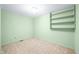 The bedroom features built-in shelving and standard carpet at 5052 Helmsburg School Rd, Morgantown, IN 46160
