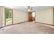 Spacious bedroom featuring neutral walls, carpet, and a ceiling fan for added comfort at 5052 Helmsburg School Rd, Morgantown, IN 46160