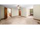 Large room with carpet, neutral walls, ceiling fan and access to multiple rooms at 5052 Helmsburg School Rd, Morgantown, IN 46160