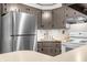 Bright kitchen with stainless steel refrigerator and view of countertop, oven and cabinetry at 5052 Helmsburg School Rd, Morgantown, IN 46160