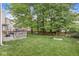 Well-manicured backyard featuring lush green grass and mature trees providing ample shade at 5299 Breakers Way, Carmel, IN 46033