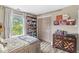 Bedroom featuring a cozy bed, full bookcase, dresser, and view of the backyard at 5299 Breakers Way, Carmel, IN 46033
