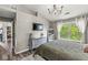 Bright primary bedroom with natural light and vaulted ceiling features an ensuite bath and walk-in closet at 5299 Breakers Way, Carmel, IN 46033