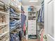 Walk in closet offers ample storage with custom shelving for clothing and accessories at 5299 Breakers Way, Carmel, IN 46033