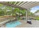 Outdoor entertaining deck features a pergola, stylish furniture, string lights, and a fenced yard at 5299 Breakers Way, Carmel, IN 46033