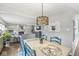 Charming dining room with stylish decor, decorative lighting, and an open view to the living room and fireplace at 5299 Breakers Way, Carmel, IN 46033