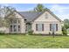 Charming single-Gathering home with a brick facade, manicured lawn, and a welcoming front entrance at 5299 Breakers Way, Carmel, IN 46033