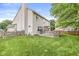 Home's exterior showcases a well-maintained yard and inviting back deck at 5299 Breakers Way, Carmel, IN 46033