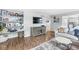 Inviting living room featuring built-in bookshelves, hardwood floors, and a comfortable sofa at 5299 Breakers Way, Carmel, IN 46033