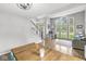 Spacious and bright living area with hardwood floors, large windows, and comfortable seating at 5299 Breakers Way, Carmel, IN 46033