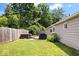 A spacious backyard featuring a hot tub and grill on a wooden deck, providing an ideal outdoor leisure and entertainment space at 5672 W New York St, Indianapolis, IN 46224