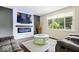 Modern living space boasts an electric fireplace, mounted TV, and comfortable seating area at 5672 W New York St, Indianapolis, IN 46224