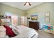 Cozy bedroom with a queen bed, light green walls, and tasteful decor at 5720 Hickory Hollow Dr, Plainfield, IN 46168