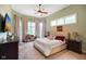 Inviting bedroom with neutral tones, large windows, and a comfortable queen-sized bed at 5720 Hickory Hollow Dr, Plainfield, IN 46168