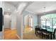 Elegant dining room with hardwood floors, archway details, and a chandelier at 5720 Hickory Hollow Dr, Plainfield, IN 46168