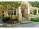 Inviting front entrance with stone accents, elegant columns, and a well-manicured landscape at 5720 Hickory Hollow Dr, Plainfield, IN 46168