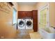 Laundry room featuring new front load washer and dryer, and built-in cabinetry at 5720 Hickory Hollow Dr, Plainfield, IN 46168