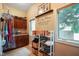 Bright laundry room with built-in cabinets, folding table, and windows at 5720 Hickory Hollow Dr, Plainfield, IN 46168