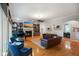 Open-concept living room with hardwood floors, fireplace, built-in shelving and ample natural light at 5720 Hickory Hollow Dr, Plainfield, IN 46168