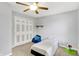 Bedroom features include a ceiling fan, a twin bed, a closet, and light blue colored walls at 5841 Sable Dr, Indianapolis, IN 46221