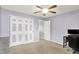 Bedroom with large closet, ceiling fan, desk, and two windows for natural light at 5841 Sable Dr, Indianapolis, IN 46221