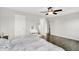 Bright bedroom boasting wood floors, ceiling fan, and vanity area at 5841 Sable Dr, Indianapolis, IN 46221