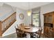 Bright dining area with an elegant dining table and chairs, complemented by natural light at 5841 Sable Dr, Indianapolis, IN 46221