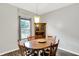 Cozy dining space featuring a classic table set, wooden chairs, and ambient lighting at 5841 Sable Dr, Indianapolis, IN 46221