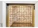 The dog crate features brick and wood-look flooring, built into the wall at 5841 Sable Dr, Indianapolis, IN 46221