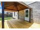 View of the backyard gazebo and deck attached to the home's brick exterior at 5841 Sable Dr, Indianapolis, IN 46221