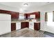 A kitchen is with white appliances, stylish counters, and wood-look flooring at 5841 Sable Dr, Indianapolis, IN 46221